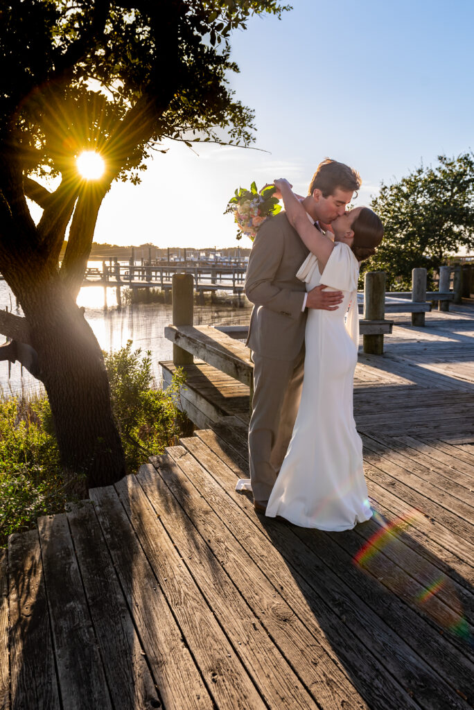 bride and groom kissing at sunset, 5 wedding trends for 2025, affordable wedding photographer, beaufort photography co., top wedding trends for 2025