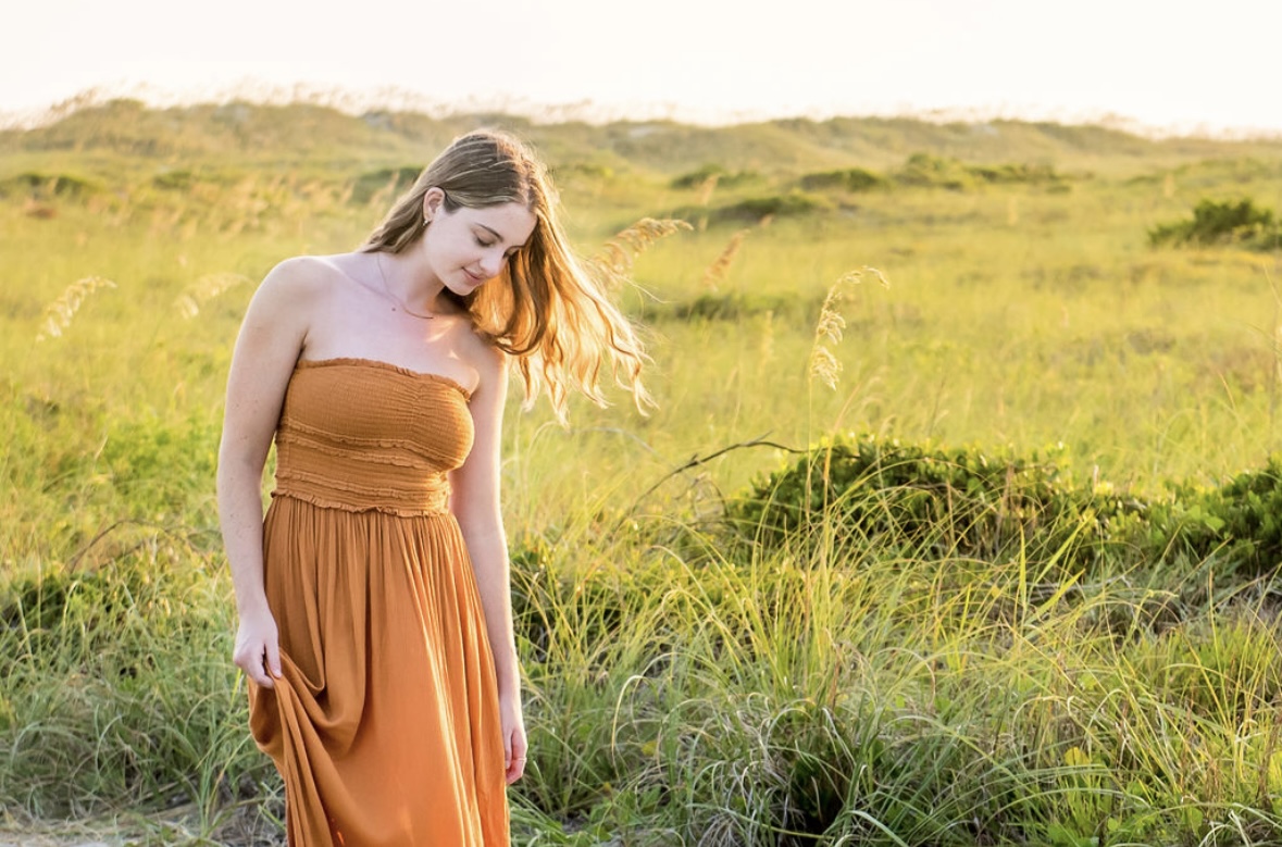 high school senior girl on the dunes in atlantic beach nc, atlantic beach senior photographer, beaufort photography co., what to look for in a senior photographer