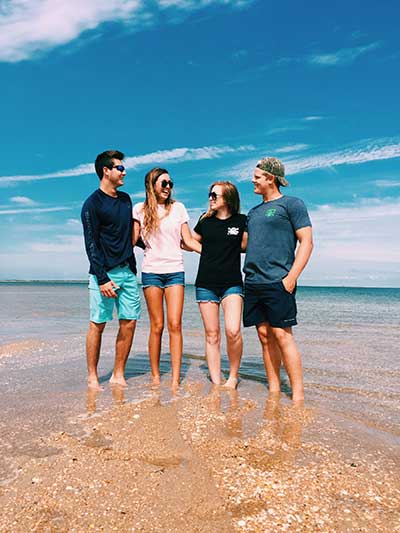 people standing on beach
